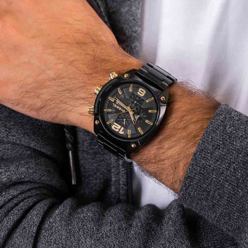 Reloj diesel best sale negro y dorado