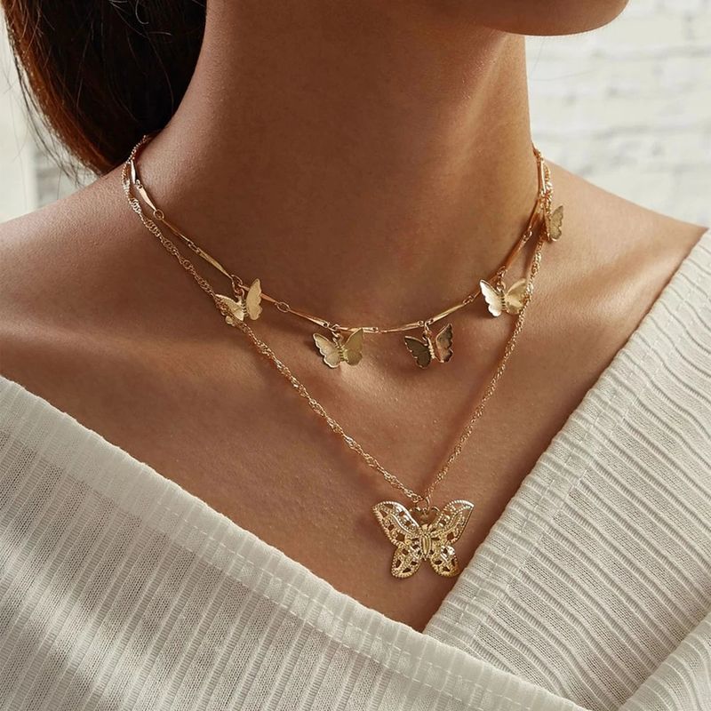 Collar-doble-de-mariposa-dorado-